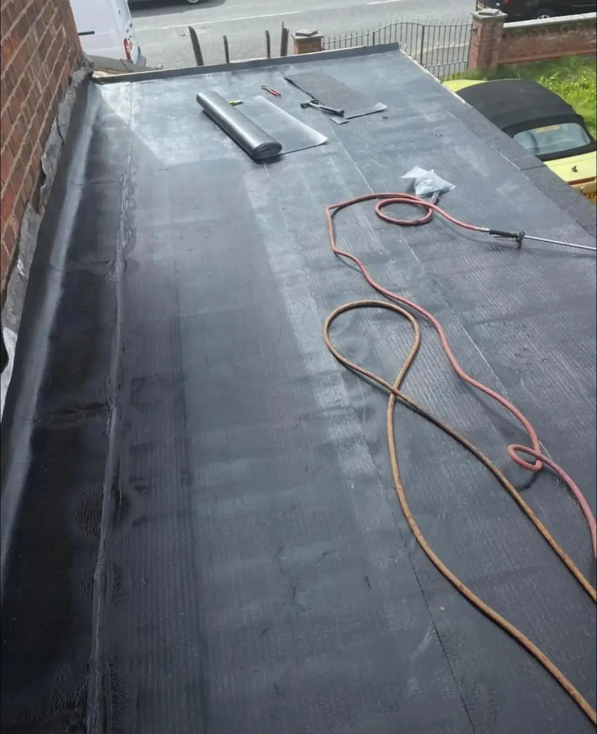 A flat roof, deck to finish: torch-on felt